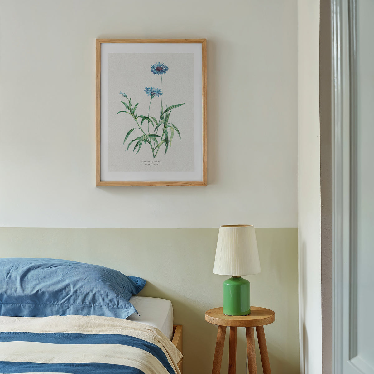 vintage cornflower art print framed above bed. Vintagle flowr wall art in bedroom