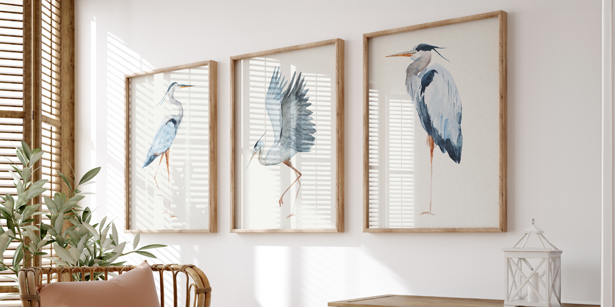 a set of three vintage heron art prints in a living room - beach house art best sellers