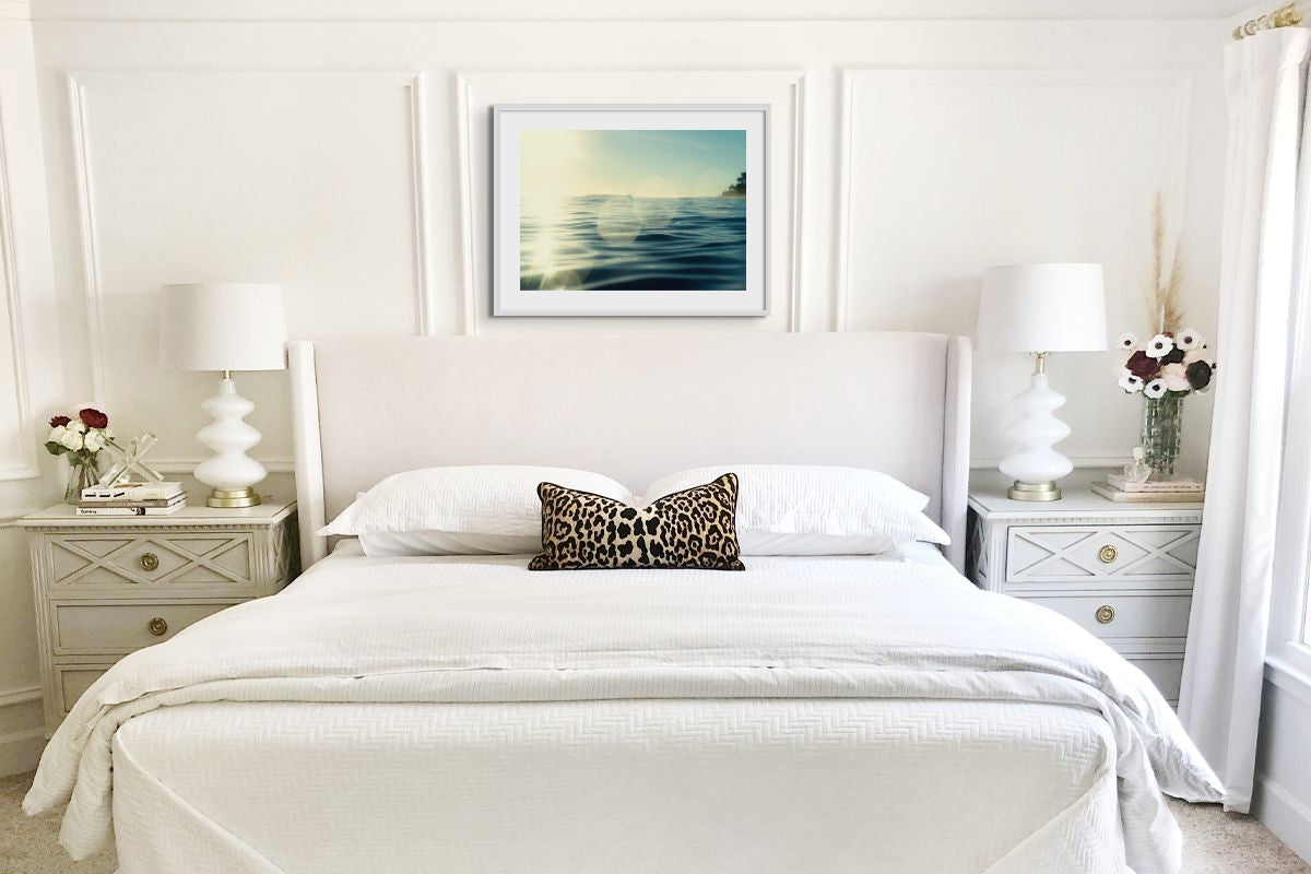 Framed bedroom photography art print - coastal art print is above the bedhead in a white bedroom. framed bedroom print