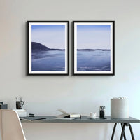 a set of two moody paintings at dawn on a beach near Padstow above a office table - Beach House Art