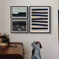 A set of three paintings in black frames from Beach House Art | Headland Point Print | Modern Seascape Painting