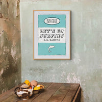 framed print of the vintage book cover art poster "Let's Go Surfing" in aqua blue. 