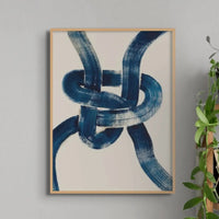 loose knot art print with a blue velvet armchair and bookshelf