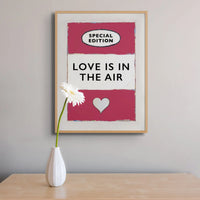 framed print of the Vintage Book Cover for "Love is in the Air" song lyric art print in red (Viva Magenta) - Framed Wall Art