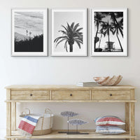 set of three black & white beach art photographs above a coastal sideboard  - beach house art